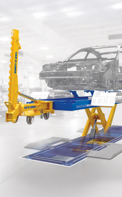 a car frame lifted on a benchrack versa with attached draw aligner