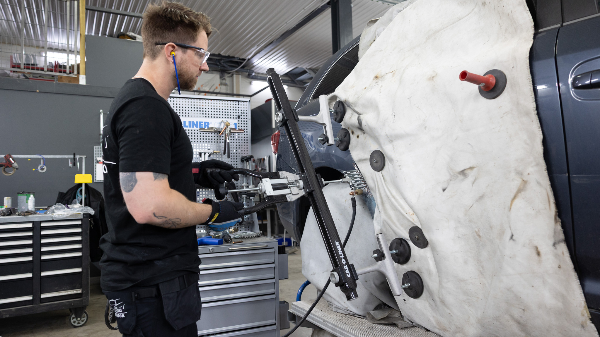 A technician performing a body repair.